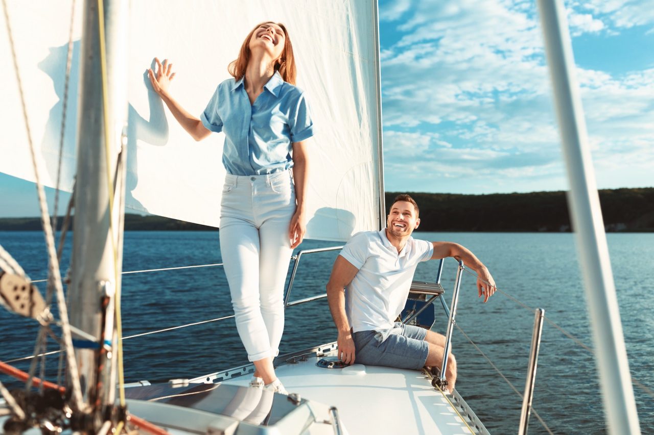 Happy yacht owners on their boat