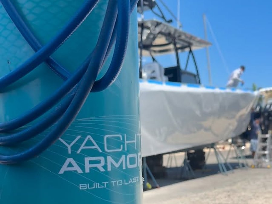 Yacht Armor protective film on site at a South Florida boatyard, sportfish hauled out behind