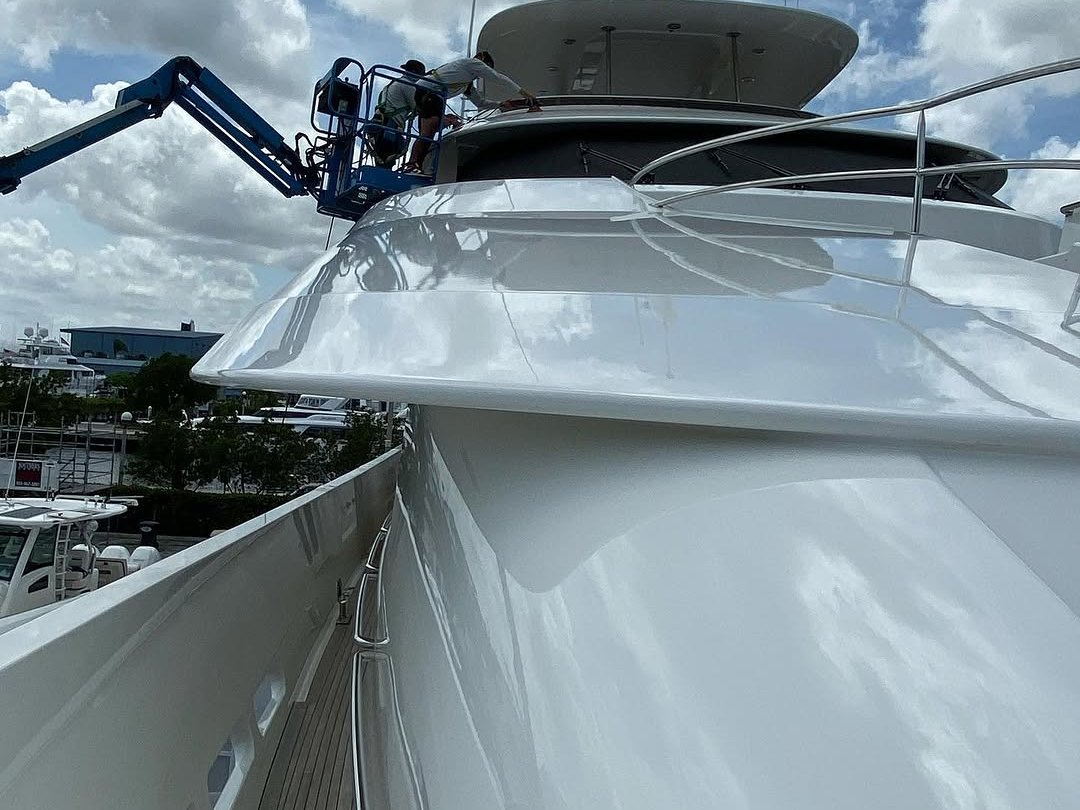 Polished flybridge and teak side deck of a motor yacht serviced by Correct Reflect