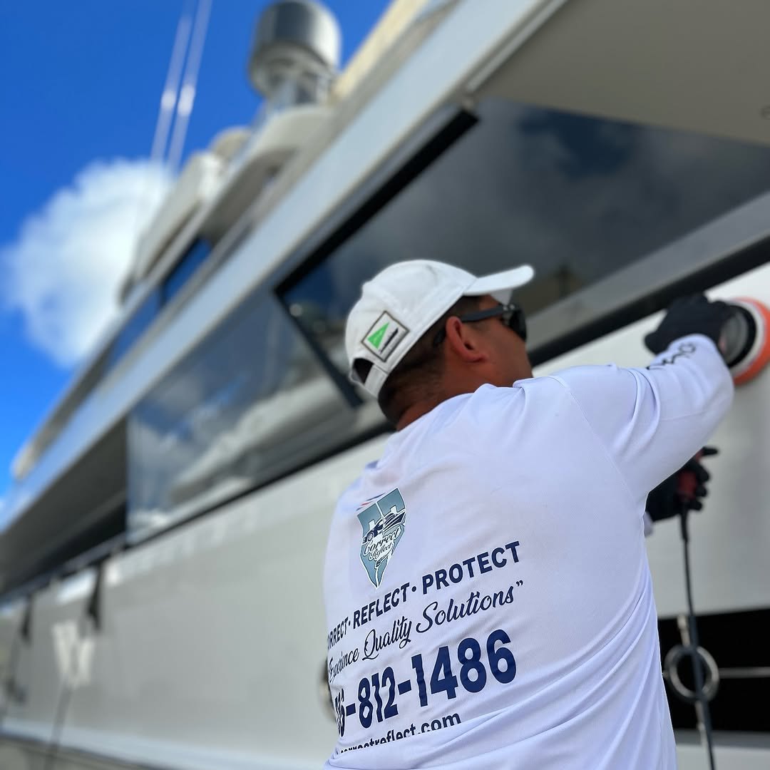 Correct Reflect technician machine polishing a superyacht hull in Miami, FL